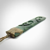 Hand made large New Zealand jade toki with koru pendant. Hand carved in New Zealand by Kerry Thompson. Hand made jewellery. Unique large Jade Toki with adjustable cord. Free shipping worldwide.